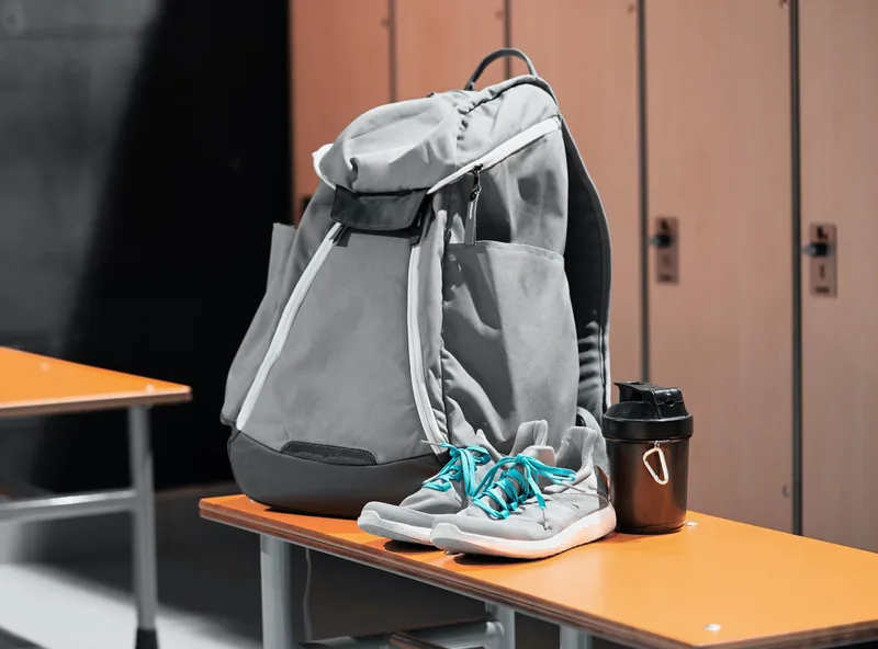 Sports bag and court gear beside the Pickleball Park NZ courts